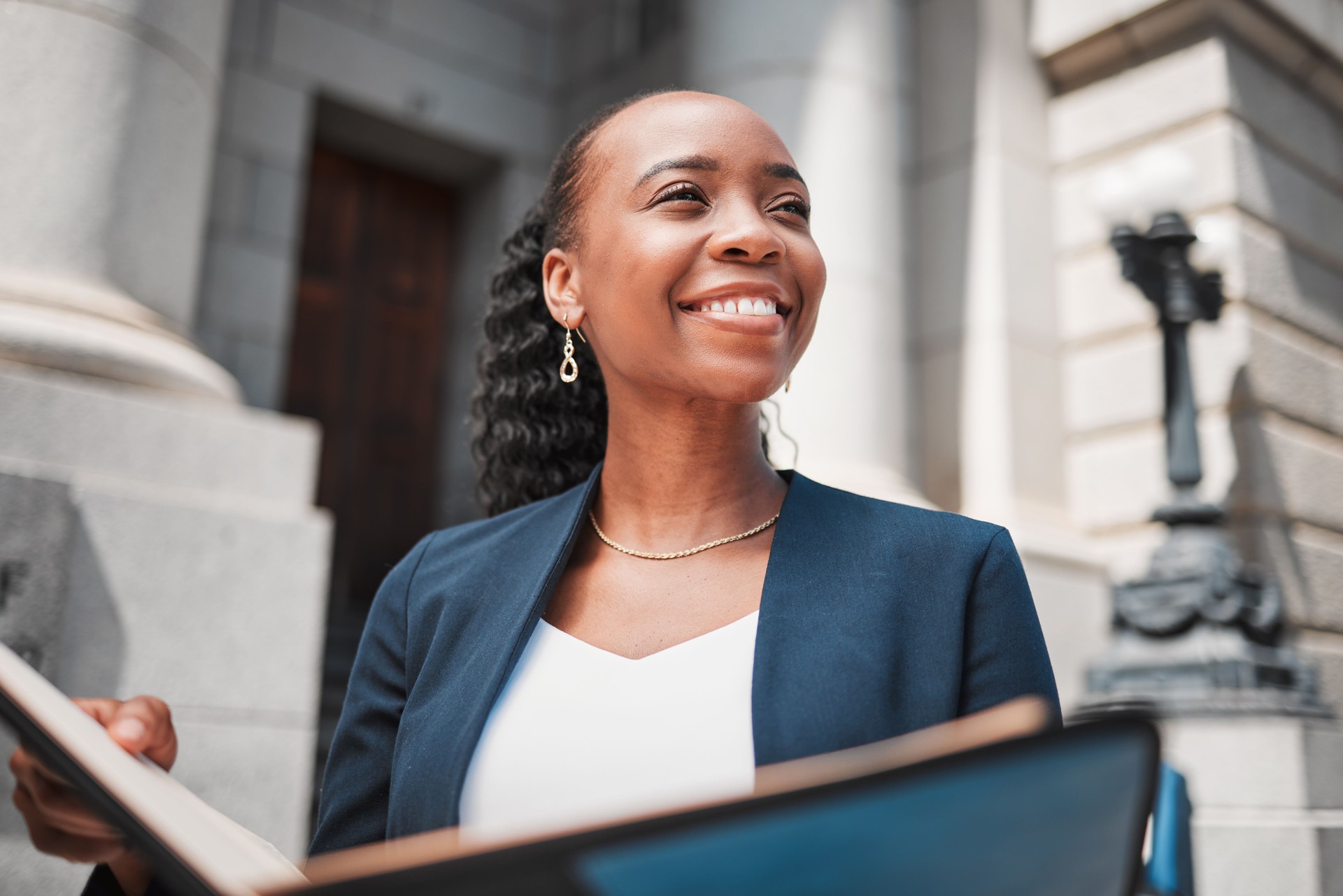 Book, black woman or happy lawyer with education, legislation or constitution research by law firm. Reading, studying or attorney thinking of knowledge, ideas or vision for legal agency by court